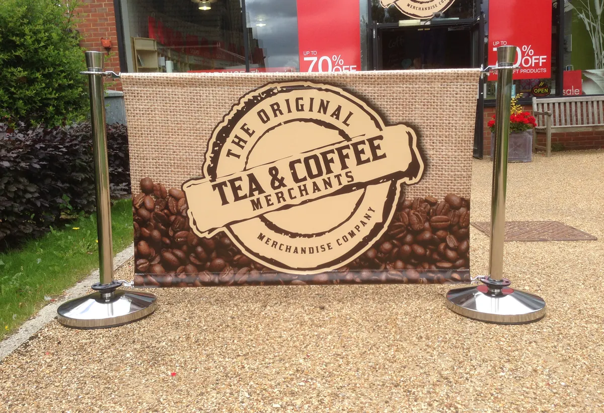 Printed Tea and Coffee Merchants banner outside a shop