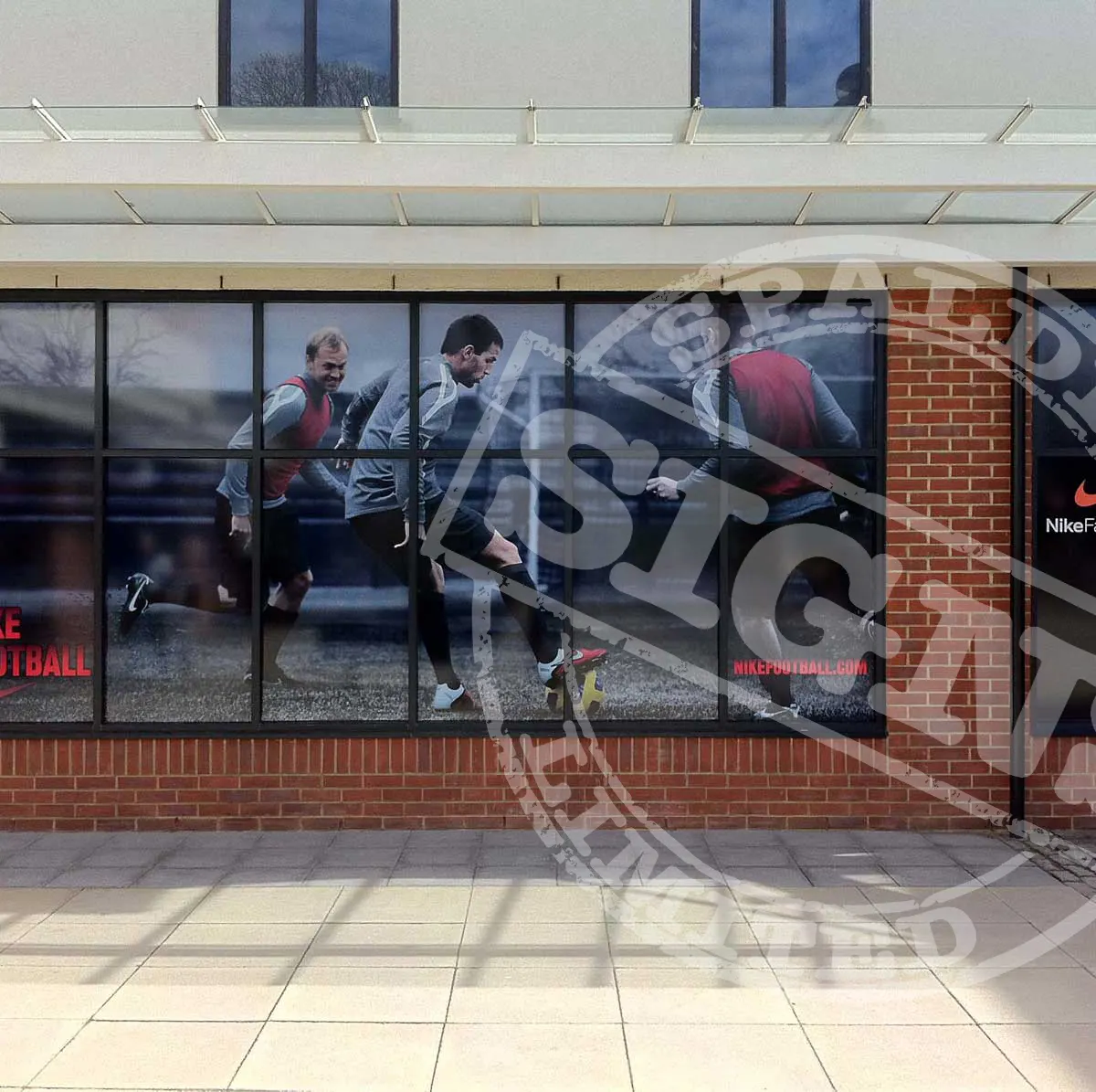 Nike Factory Store window graphics fitted across a shopfront